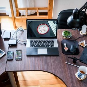 Designer creating stunning visual branding for a business using a laptop